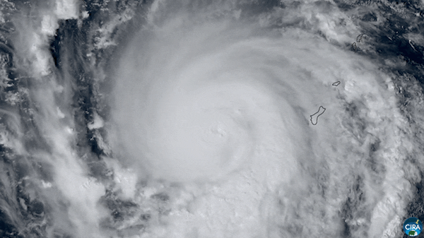 GIF of a rapidly swirling typhoon from above.