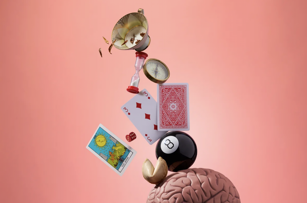 An illustration of predictive objects (tea leaves, cards, a magic 8 ball) falling into a brain