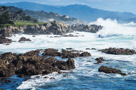 Waves crash on a rocky coastline
