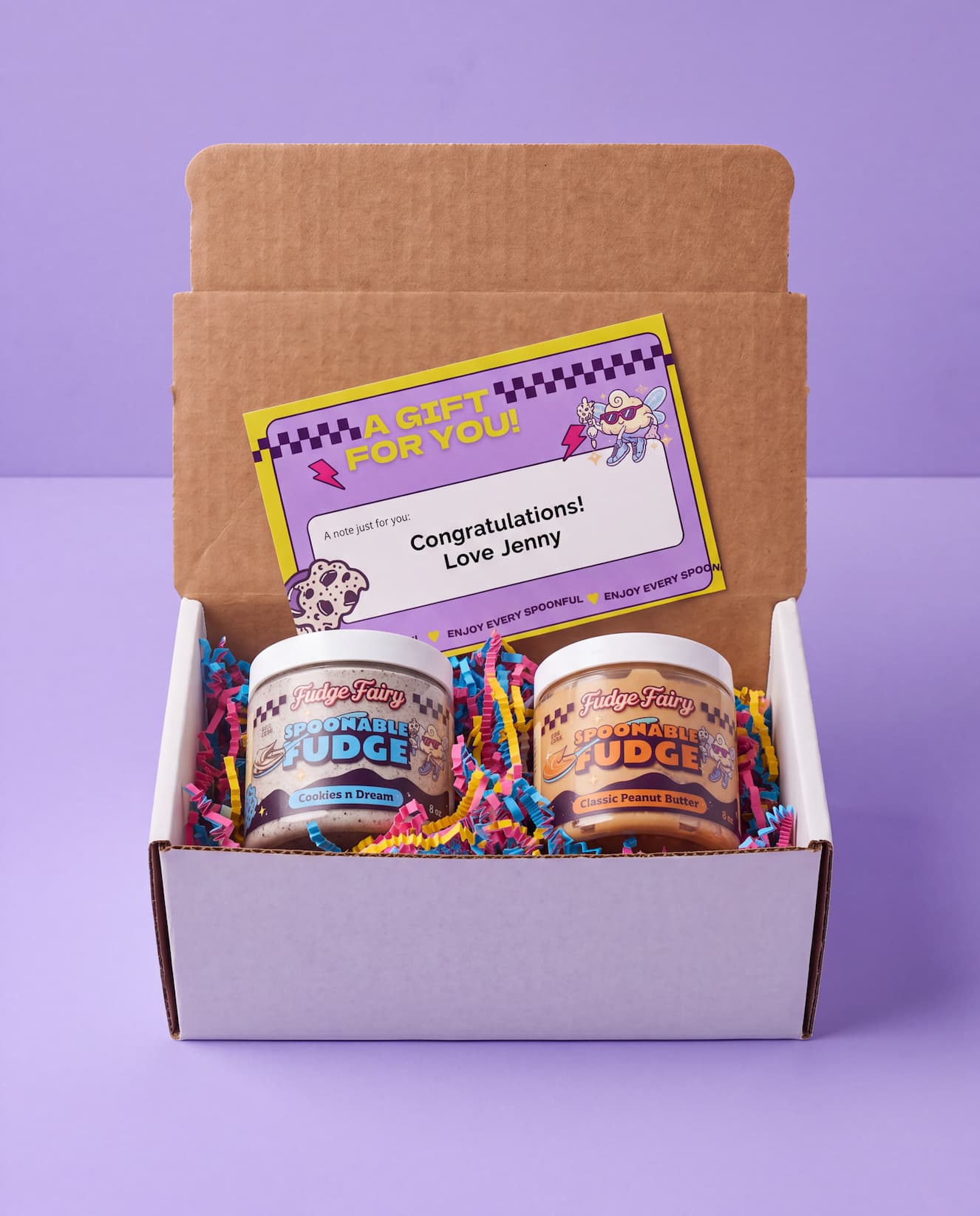 Gift packaging preview — open box with branded card, crinkle paper, and two 8 oz fudge jars