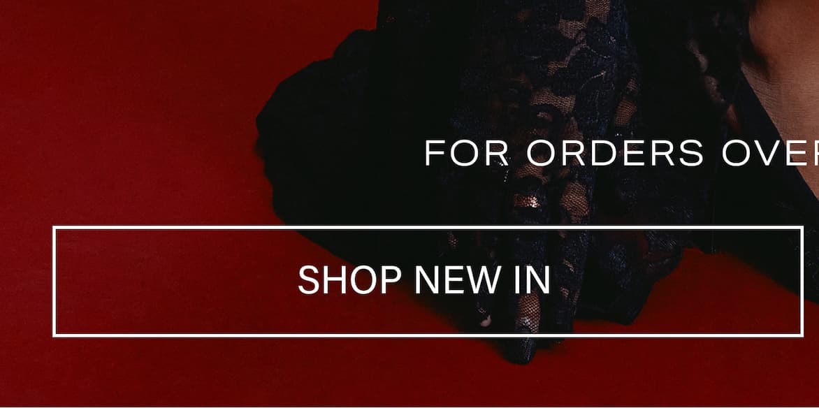 Black lace fashion top on a deep red backdrop with subtle model outline. Text: "FOR ORDERS OVER" and "SHOP NEW IN" for new arrivals.