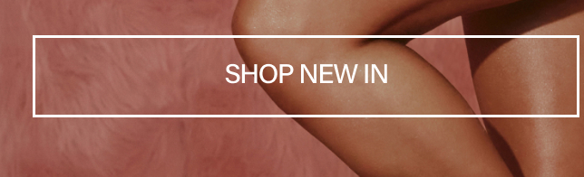 Glowing, bronzed legs on a plush dusty pink fur background featuring a white SHOP NEW IN overlay banner promoting new body care arrivals.