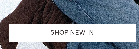 Close-up: textured brown fabric and blue denim pants, with a 'SHOP NEW IN' banner. Discover our exciting new arrivals and fashion collection.