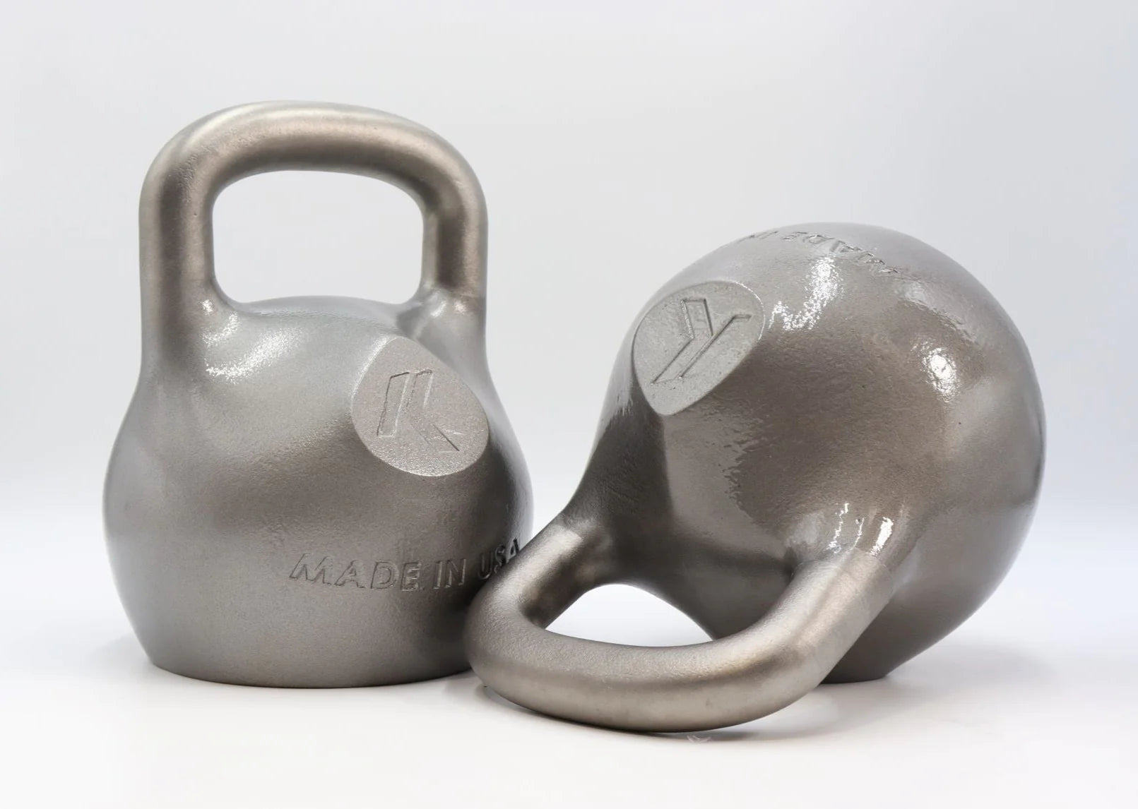 A pair of silver Pro Kettlebells with ergonomic contours