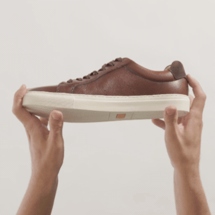 Brown leather Presidio sneakers with white soles and a "Hubbard Rebound System" label.