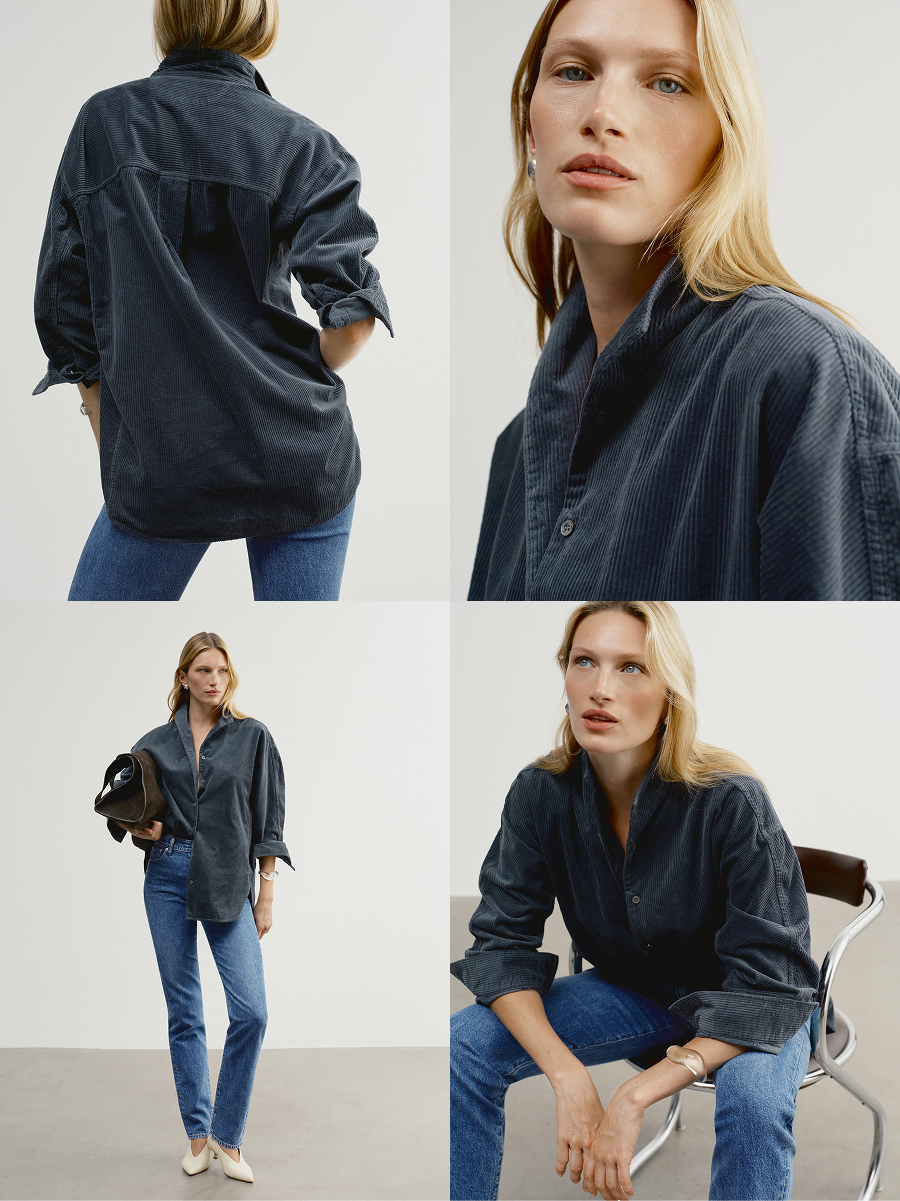 An elegant, face-framing stand collar shirt with deep dolman sleeves and extended shirt tail for a bossy fit.